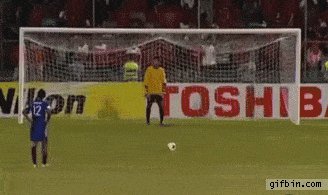 Football player falls before scoring penalty kick