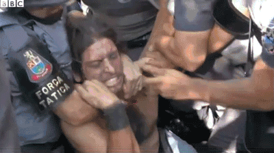 Protesters in Brazil being pepper sprayed. This is what happens in the backstage of the World Cup.