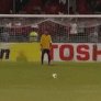 Football player falls before scoring penalty kick